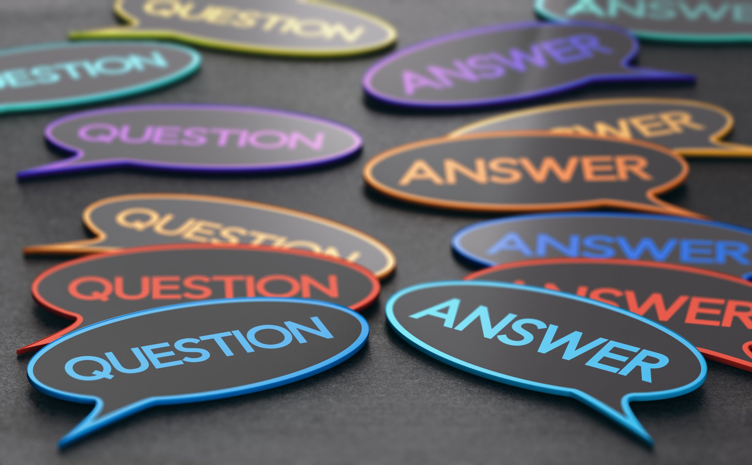 Multi-colored speech bubbles - those labeled 'question' on the left and those labeled 'answer' on the right - for questions your customers want answered first blog.