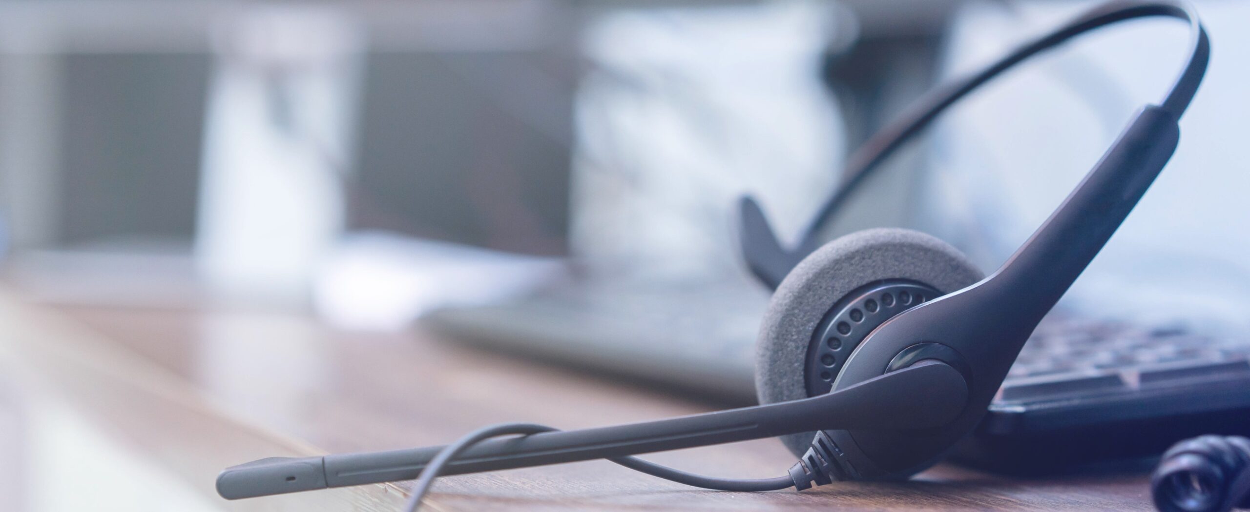 A close up of a headset for a professional telephone answering service for "How Does An Answering Service Work" blog.