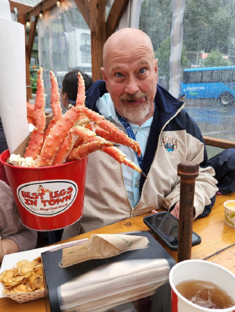 a person holding a lobster