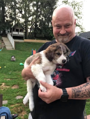 a person holding a dog