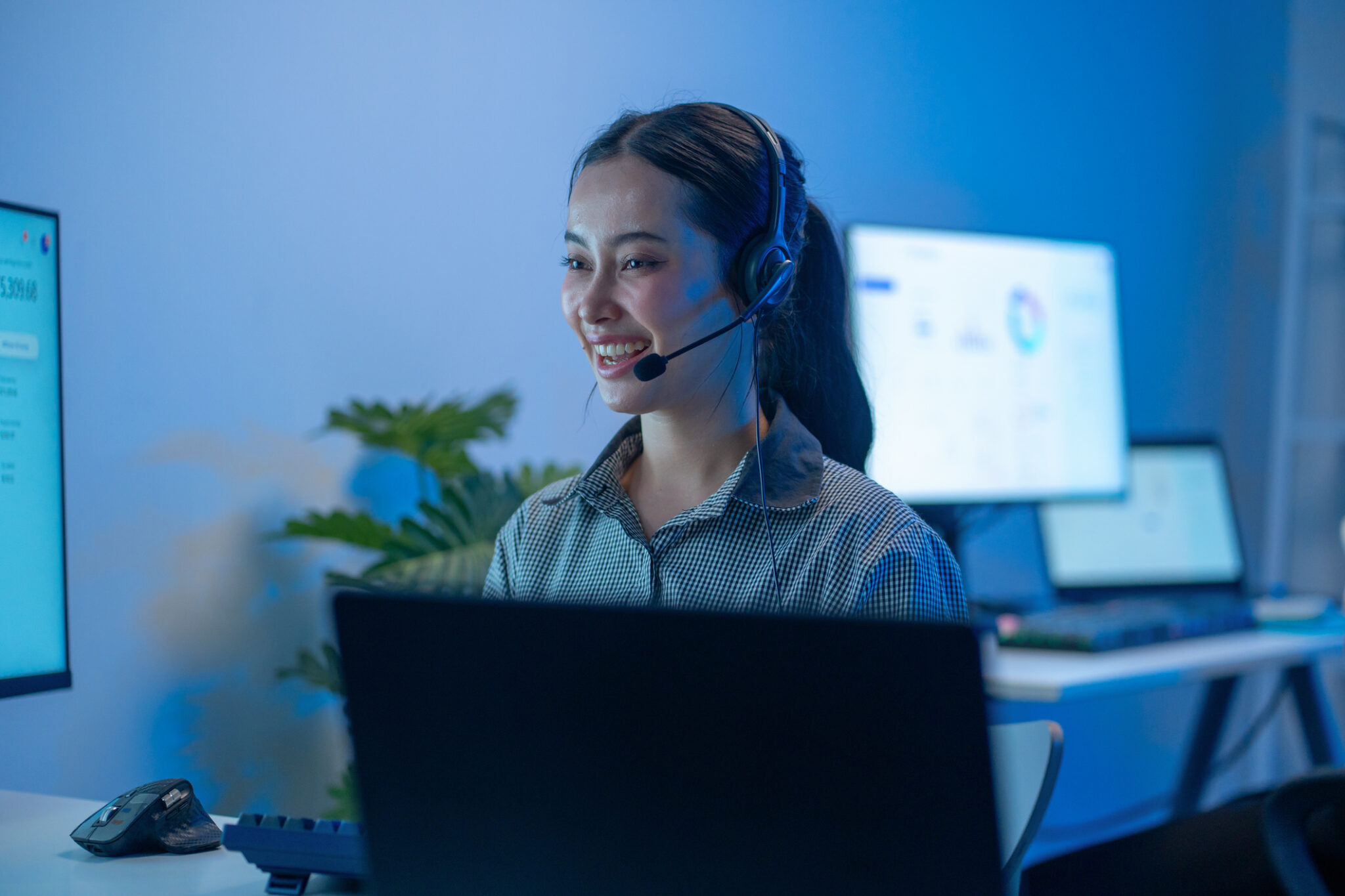 Asian sales executive discussing real estate and e-commerce, showcasing leadership and dedication in a corporate setting.