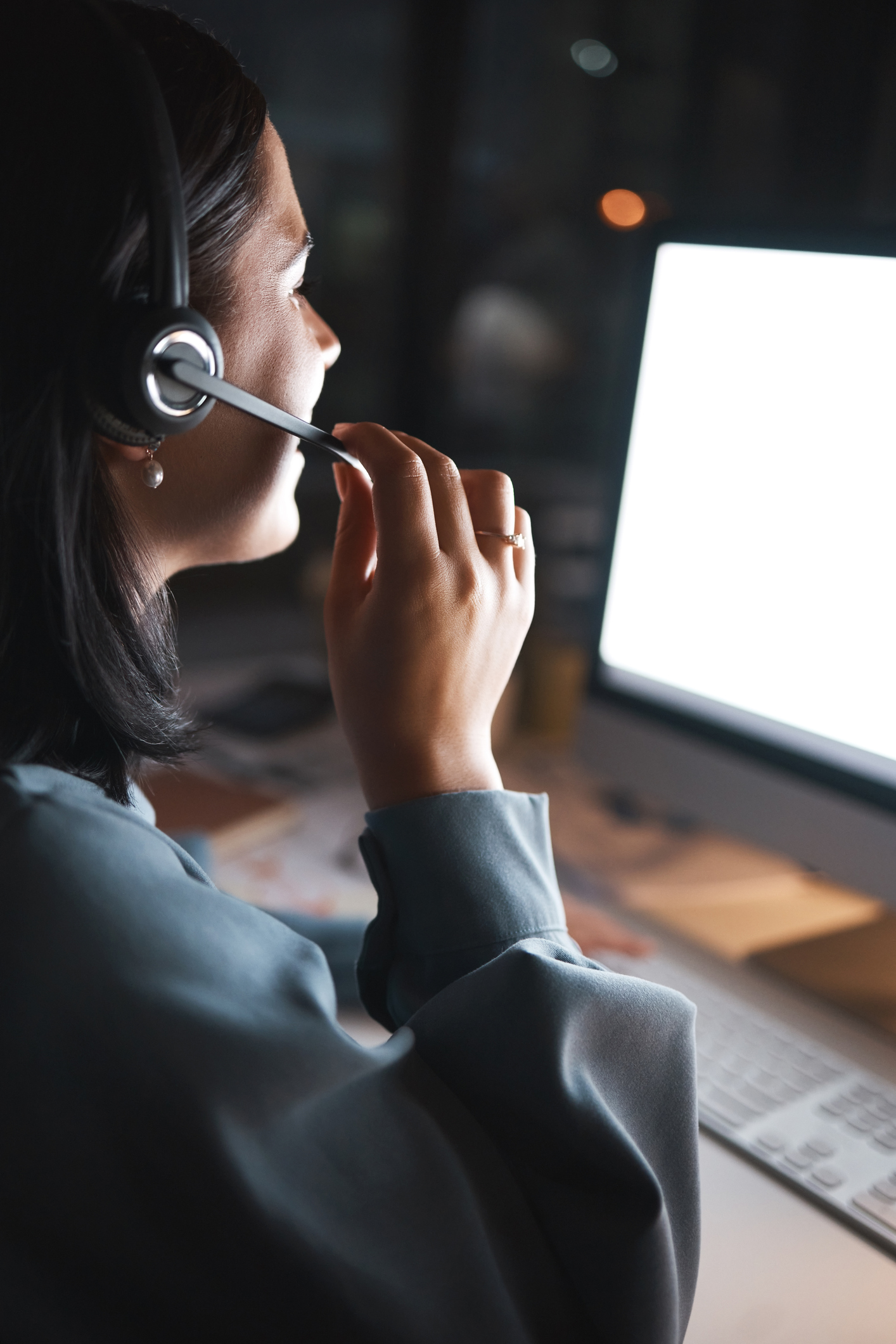 Business woman, consultant and call center in telemarketing, customer support or service for night at the office. Female employee agent in consultation, advice or hotline working the late shift