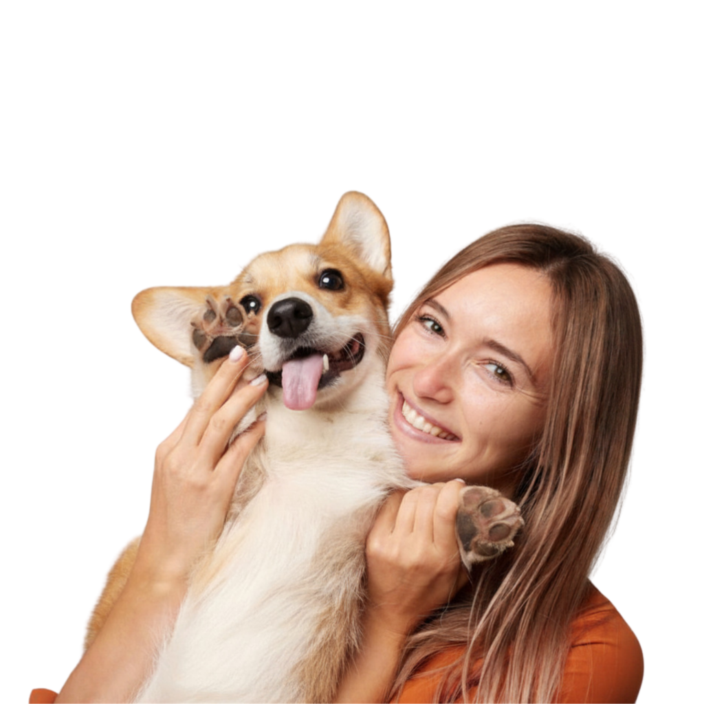 Woman holding Corgi smiling and waving