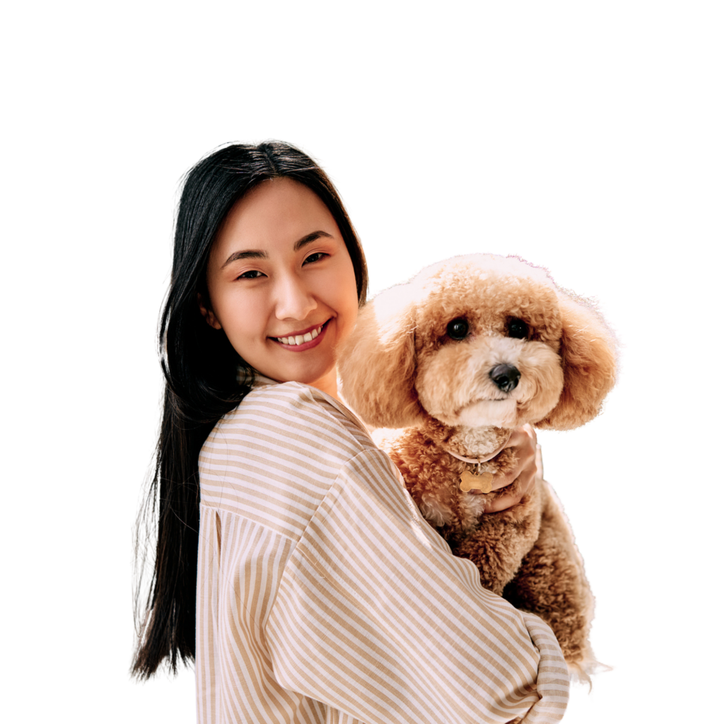 Smiling woman holding fluffy dog
